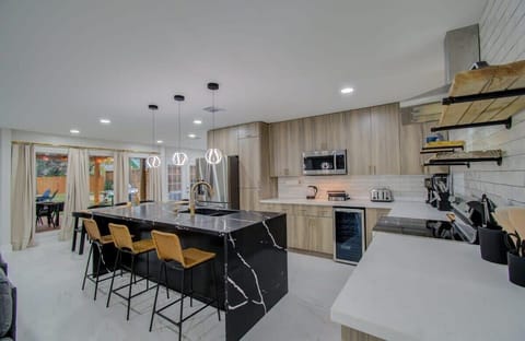 Featuring a bold contrasting center kitchen island that brings as much personality to the space as you do, this fully equipped kitchen has everything you need to whip up a tasty meal!