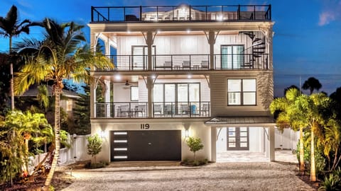 Night Time House Front View with rooftop patio.