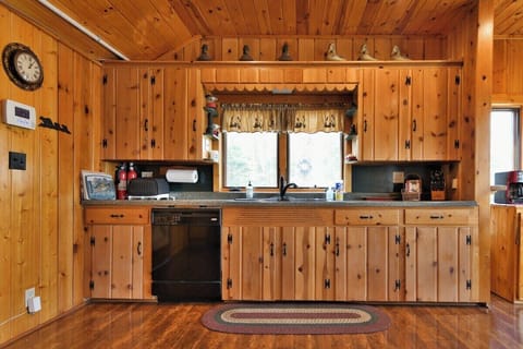 Cute Knotty Pine cabinets with modern upgrades, like a dishwasher!