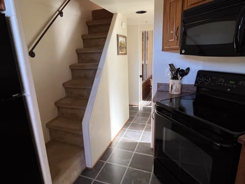Kitchen and stairs to loft
