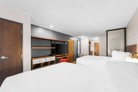 Suite, 2 Queen Beds, Non Smoking | Desk, laptop workspace, free WiFi, bed sheets