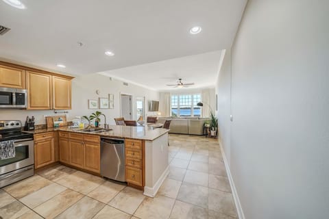 The fully equipped kitchen features granite countertops, stainless-steel appliances, and has everything you need to enjoy meals with family and friends.