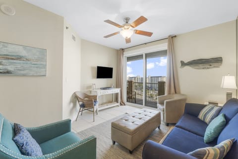 Cozy living room with balcony access and city views