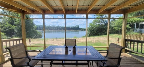 Looking out over the Tennessee River from inside the tin roof screened patio