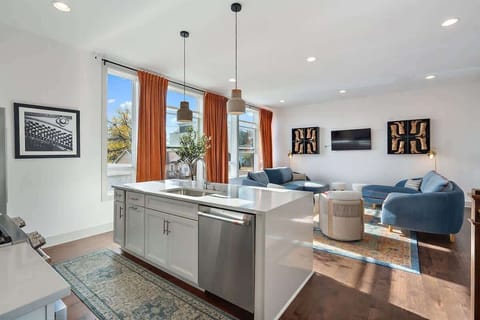 Open-concept kitchen and living room designed for gathering, entertaining, and making memories together.