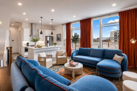 Bright, airy living area with stylish furnishings and city views, perfect for relaxing in the heart of Nashville.