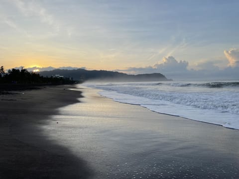  Jaco mornings start with golden hues and ocean views. Just 7 minutes away! ☀️