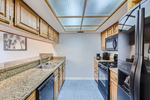 Efficiency meets style in this compact, fully-equipped kitchen.