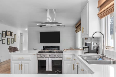 Updated and modern kitchen is fully stocked.