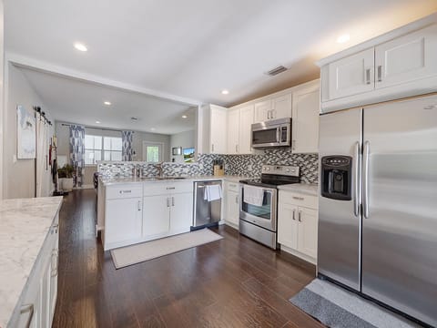 Spacious kitchen stocked with everything you need to cook meals at the home. 
