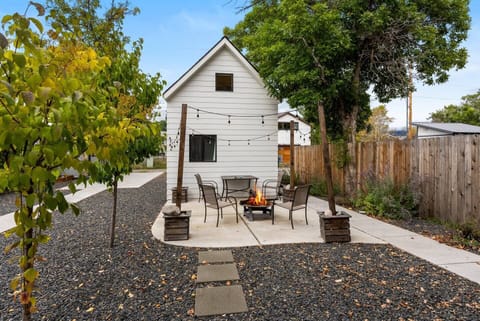 New fence added for additional privacy, Outdoor firepit, furniture and lighting.