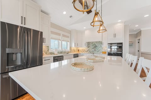 Kitchen with 9'x4' island, 5 burner cooktop, 2 refrigerators, 2 dishwashers.