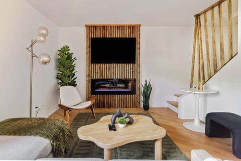 Stylish living area with double doors leading to private courtyard lounge. 