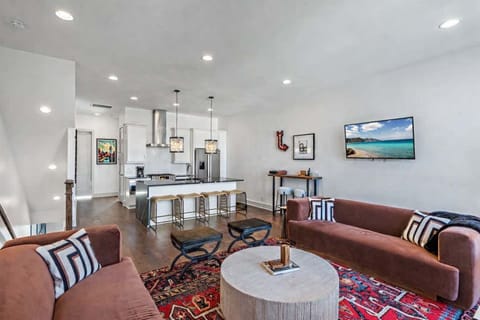 Comfortable living space conveniently connected to the stylish kitchen, perfect for relaxing and gathering together.