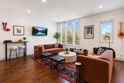Trendy décor and abundant natural light create a bright, inviting space for relaxing and entertaining.