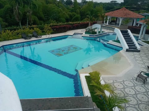 Outdoor pool, open 8:00 AM to 9:00 PM, pool umbrellas, sun loungers