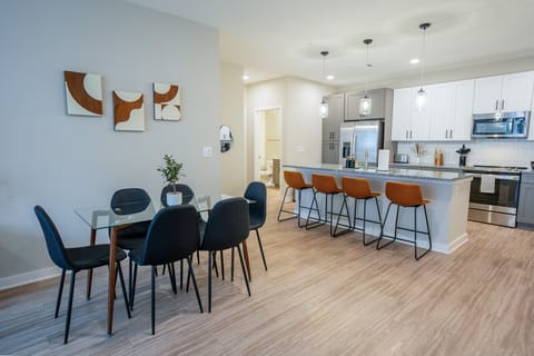 Welcome to our open kitchen! Equipped with sleek stainless steel appliances and ample counter space, it`s perfect for cooking and quick meals.