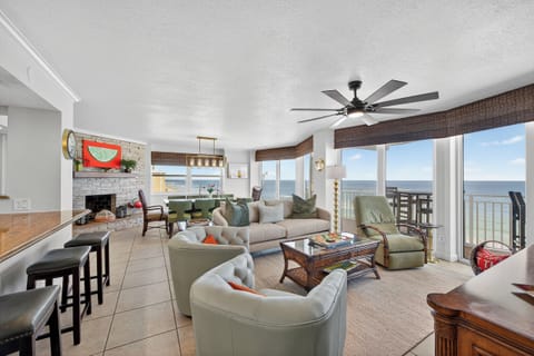 This spacious, open concept living room area has incredible views from every angle