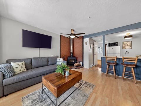Unwind in your cozy living space with a warm fireplace, modern entertainment, and stylish furnishings that create the perfect home-away-from-home atmosphere.