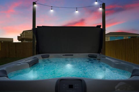 Unwind in the tranquil embrace of warm, bubbling waters as the sky paints a masterpiece at dusk.