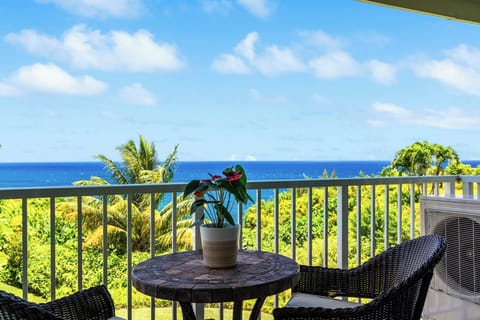 Morning coffee on the lanai, the Pacific filling the view past the rail.
