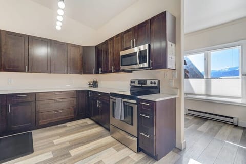 The spacious kitchen offers ample room for cooking and entertaining. With modern appliances and generous counter space, it's a functional and inviting culinary haven.
