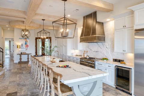 Kitchen is fully equipped and features top-of-the-line appliances.