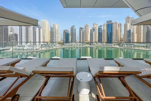 Outdoor pool, pool umbrellas, sun loungers