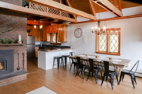 The modest kitchen and dining table with seating for up to 10.