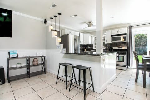 Barstools looking into kitchen area.