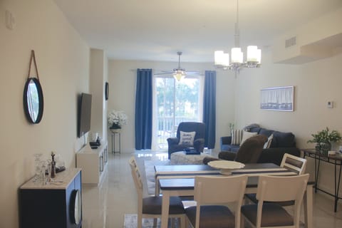 Living area extends into the dining area and kitchen in an open floor plan.