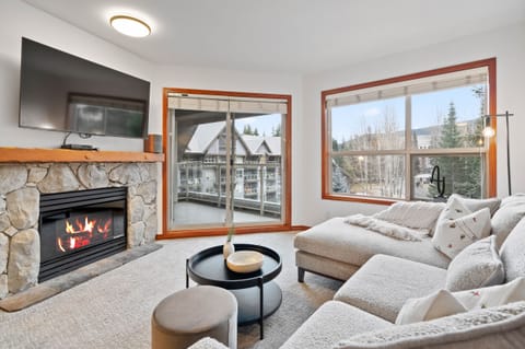 Living Room - with gas fireplace, smart TV for cable and streaming and access to your private patio.