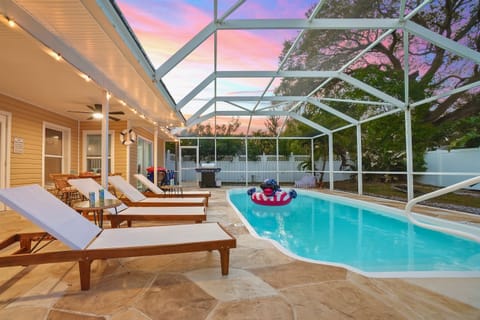 Unwind by the screened-in heated pool after a day in the sun.  Lounge chairs, soft evening lighting, and ceiling fans make it easy to relax and enjoy warm Florida nights in total comfort
