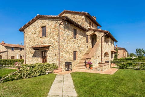 The tipical tuscan house surrounded by greenery