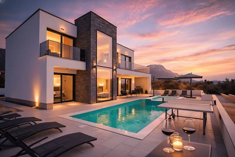Large terrace with heated pool and jacuzzi. Mountain & sea view.