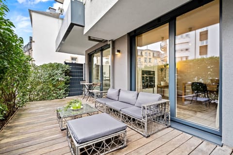 Chic outdoor lounging space, perfect for relaxation or entertaining.