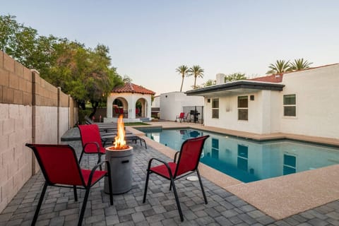 Elevate your stay with a beautifully designed backyard complete with a pool, firepit, and outdoor seating.