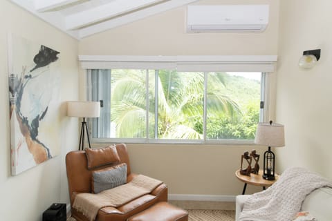 Tropical island living with swaying coconut palms just outside your window.