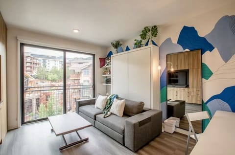Cozy couch by day to relax and watch Cable TV