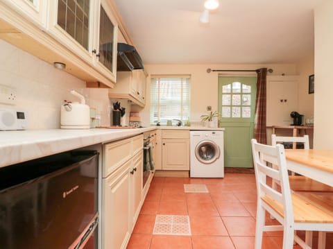 Fridge, electric kettle, toaster, cookware/dishes/utensils