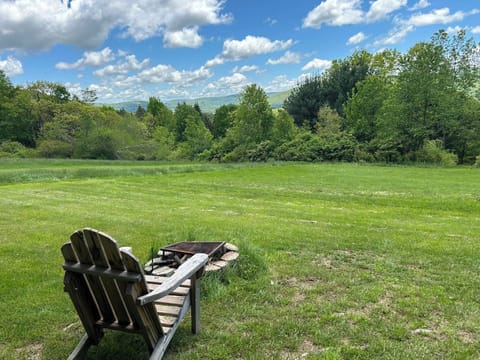 chairs at the fire pit with the view