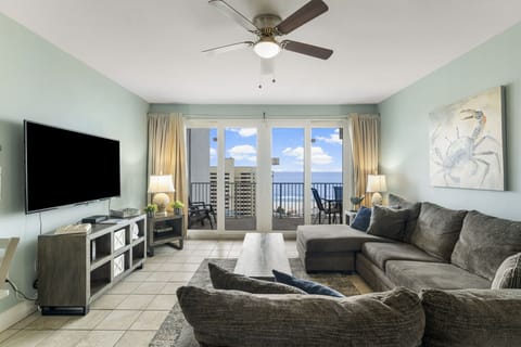 Relax in this modern living room with ocean views and balcony access.