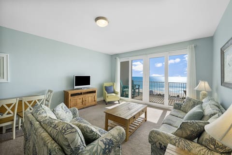 Relax in this coastal living room with ocean views and natural light.
