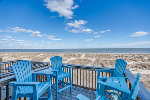 Balcony directly overlooking the beach. Four deck chairs to sit and relax.