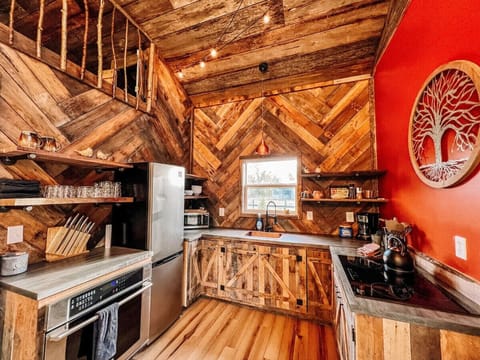 Cook in style under a hand-crafted ceiling with treehouse charm and a full kitchen ready for your cabin cravings.