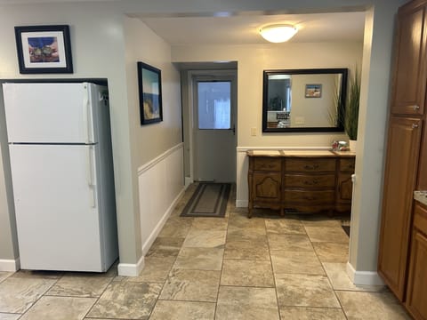 Entrance from garage into kitchen area.