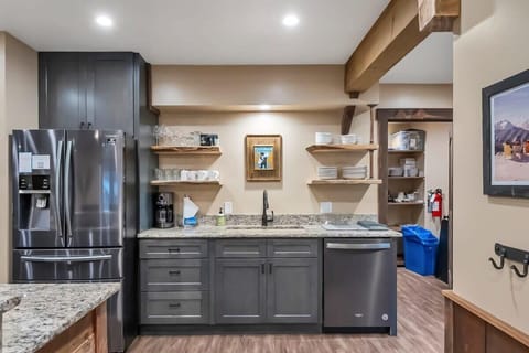 The kitchen boasts ample counter space, beautiful cabinets and woodwork, stainless steel appliances, and all the basic cookware to easily whip up some delicious meals at home.