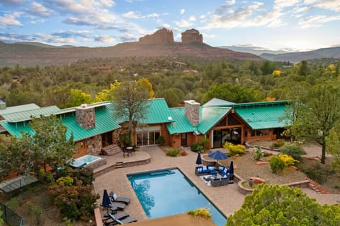 Relax by the sparkling pool with breathtaking views  of Sedona's red rocks.