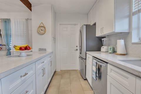 Kitchen, entryway from carport.