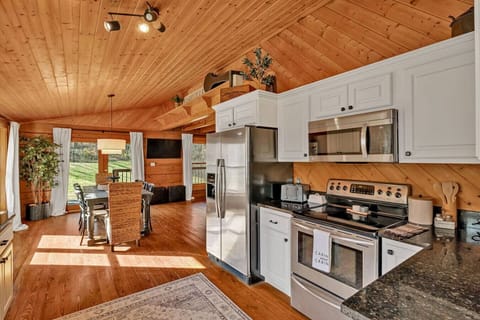 Fully stocked kitchen with stainless steel appliances and everything you`ll need to make a home cooked meal